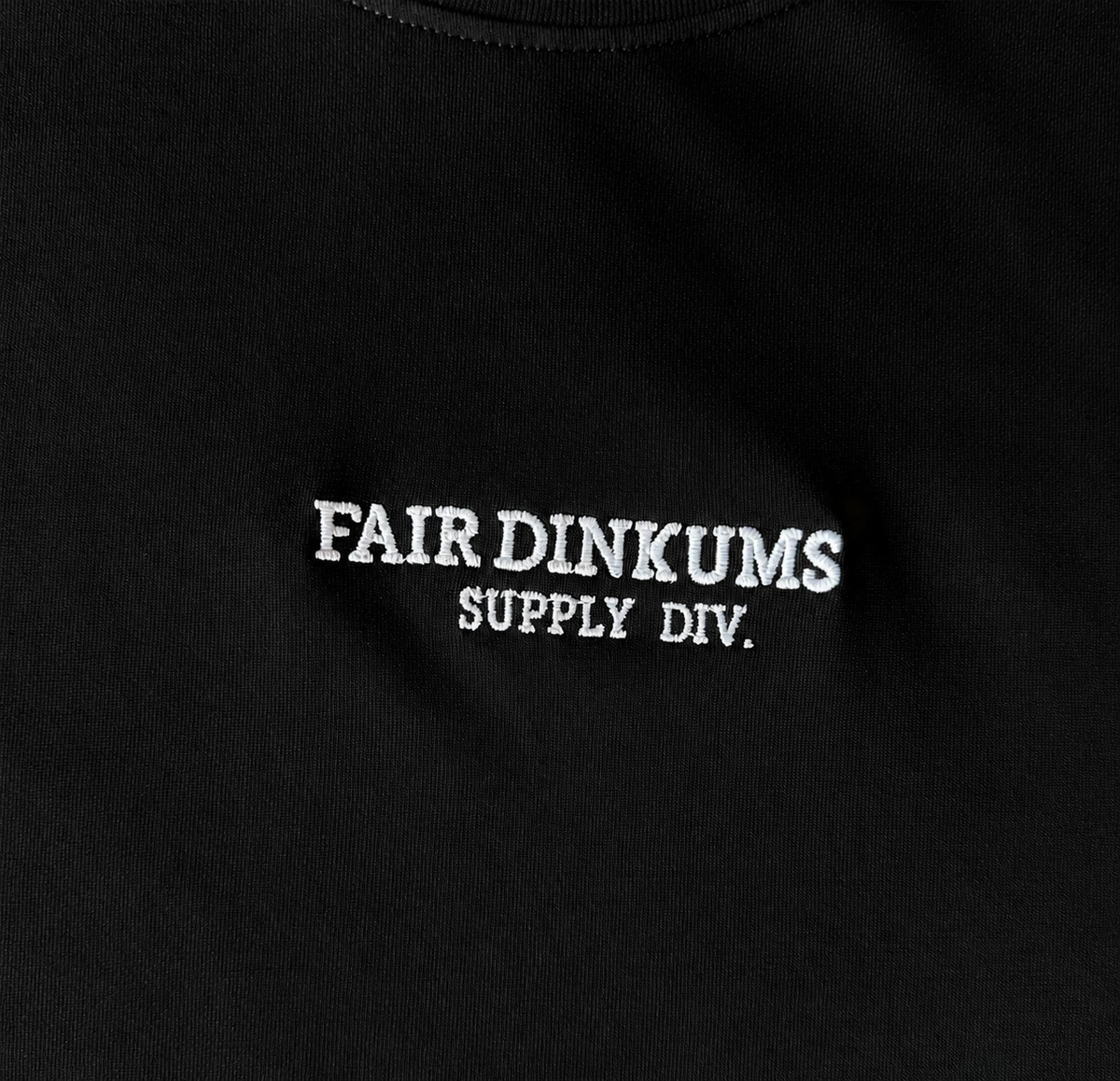 Fair Dinkums Supima Cotton Tee — Black (White Embroidery & Hem Print)